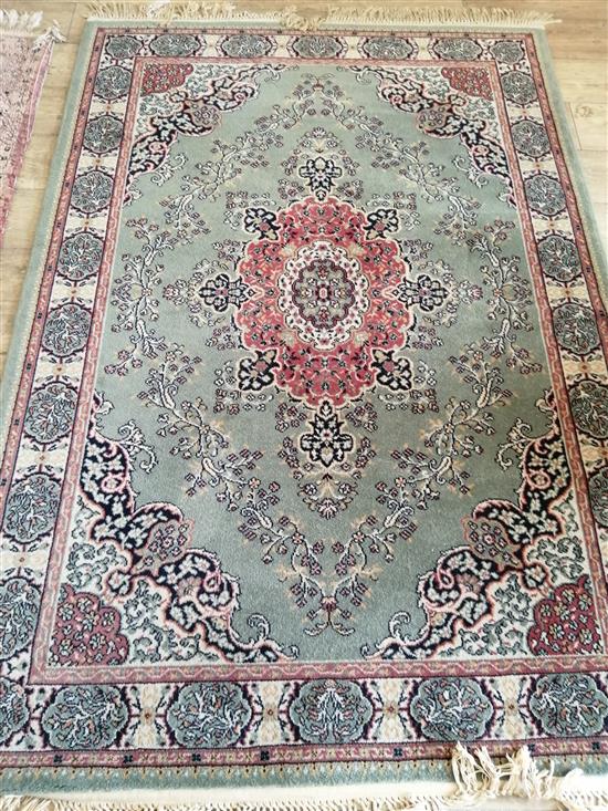 A Persian design machined green ground rug, 200 x 140cm